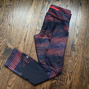 . Women's Lululemon Leggings Size 2 orange/Red Black